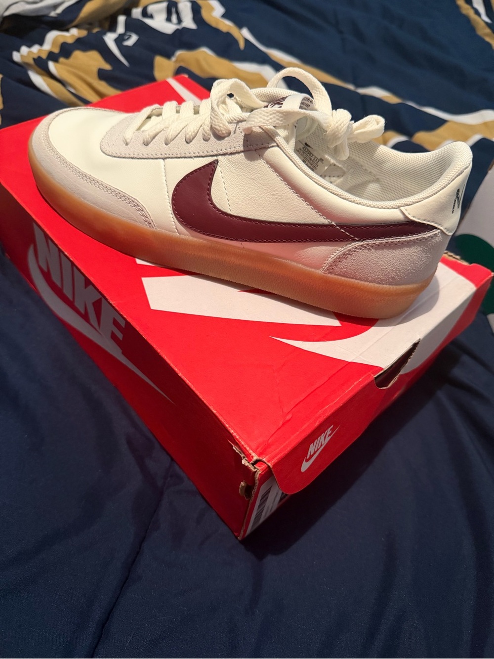 Nike White Low-Top Sneakers with Burgundy Swoosh and Gum Sole